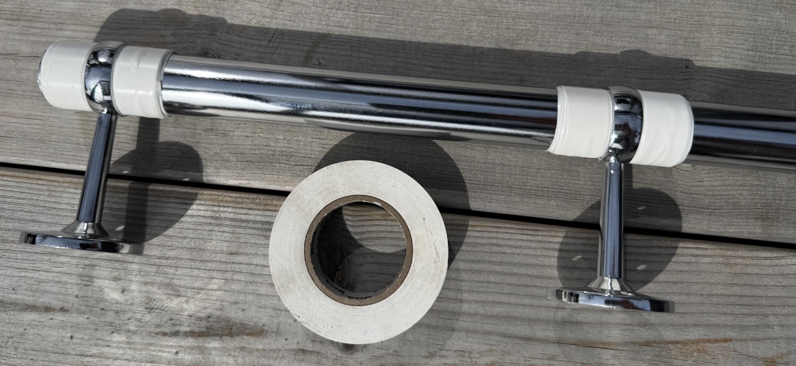 Wardrobe rail and pipe holders with universal tape
