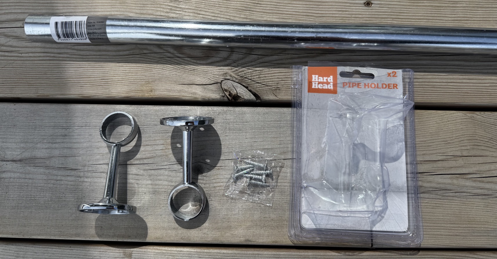 Wardrobe rail and pipe holders